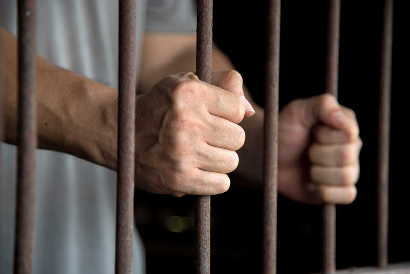 Hands of the prisoner in jail